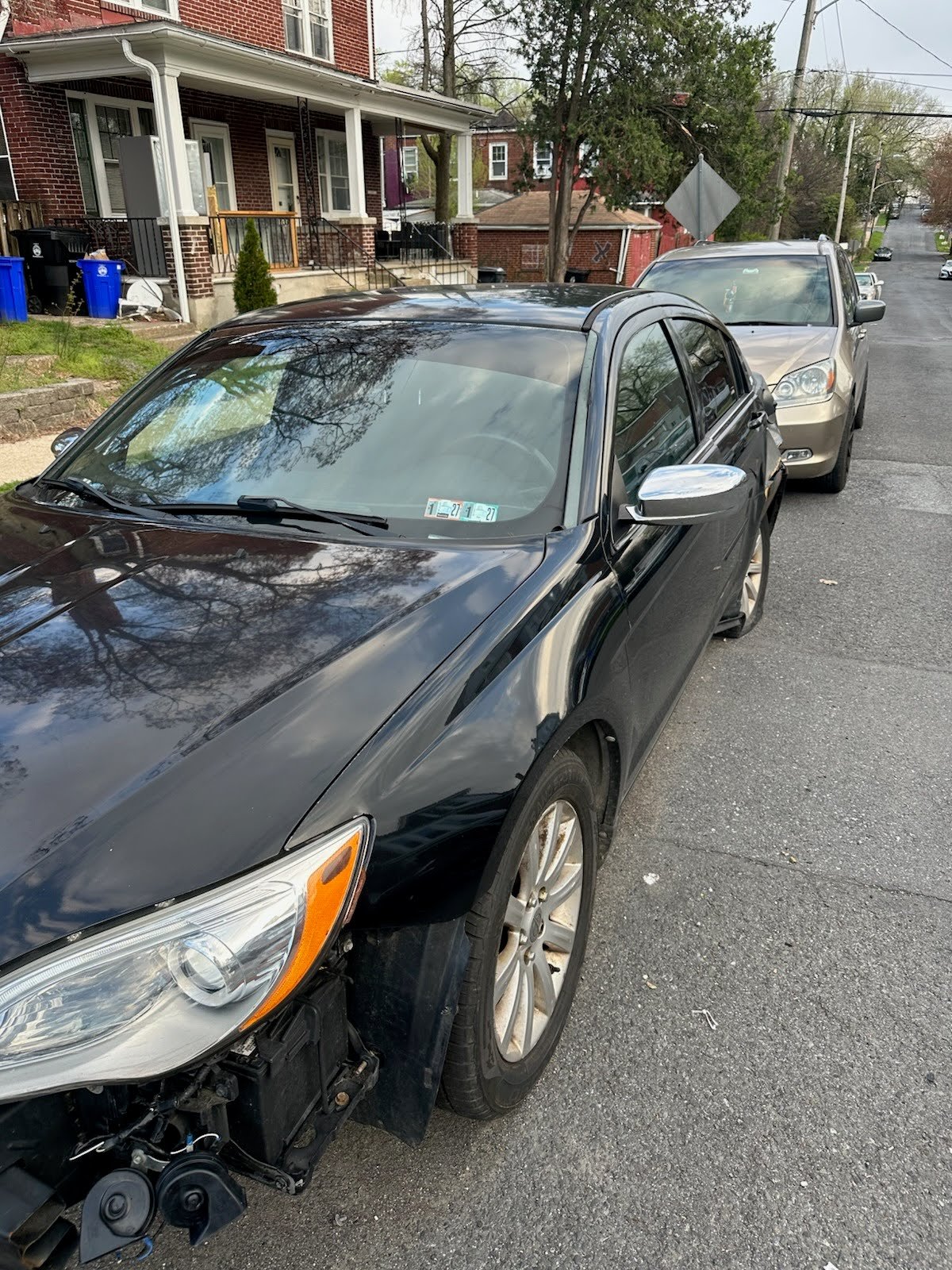 Black 2013 Chrysler 200 junk car pickup on S 20th St, Harrisburg PA.